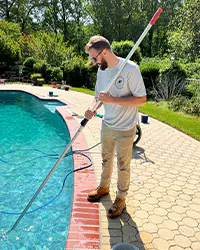 Picture of Hammerhead Pools working on pool equipment